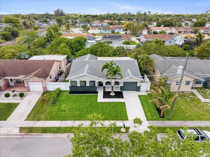an aerial view of a house with a garden