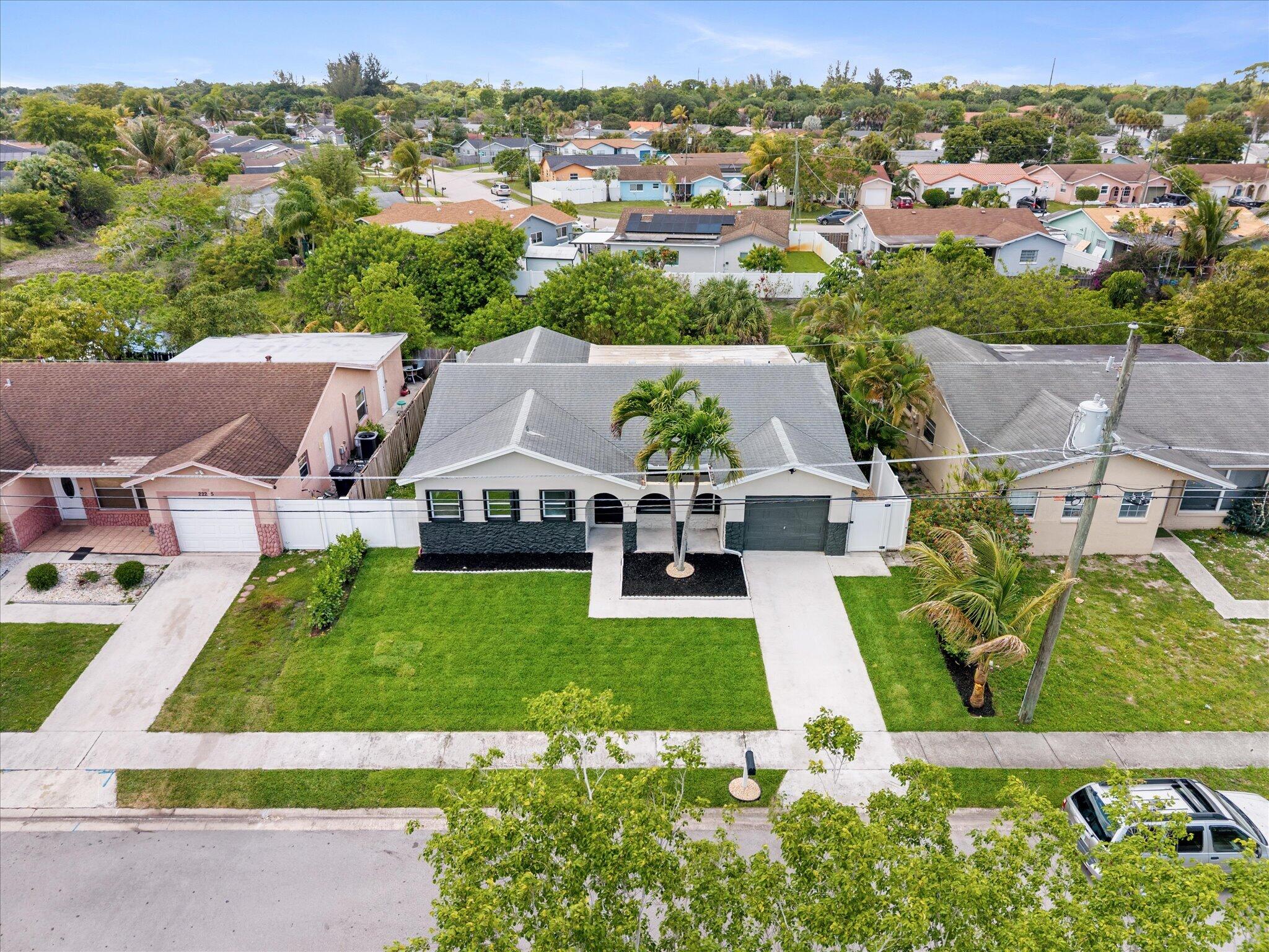 22267 Southwest 57th Avenue Boca Raton, FL 33428 - Photo 26 of 30 an aerial view of a house with a garden