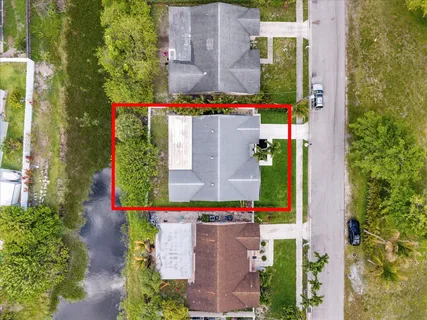 an aerial view of residential houses with outdoor space