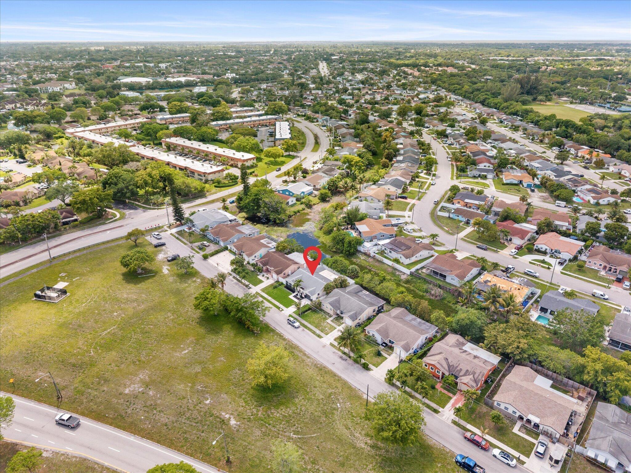22267 Southwest 57th Avenue Boca Raton, FL 33428 - Photo 28 of 30 an aerial view of residential houses with outdoor space