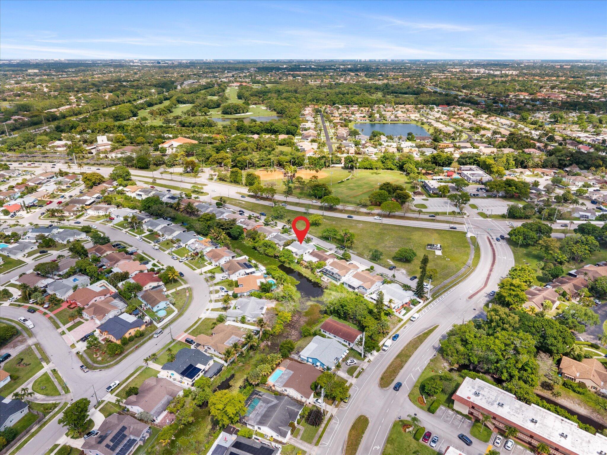 22267 Southwest 57th Avenue Boca Raton, FL 33428 - Photo 29 of 30 an aerial view of residential houses with outdoor space