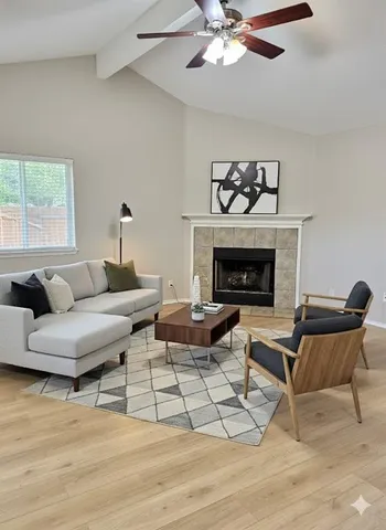 a living room with furniture and a fireplace