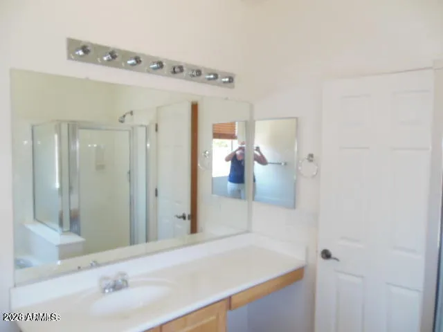 a bathroom with a sink and mirror