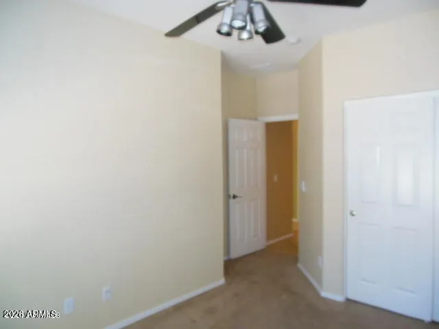 a view of a hallway with a bathroom
