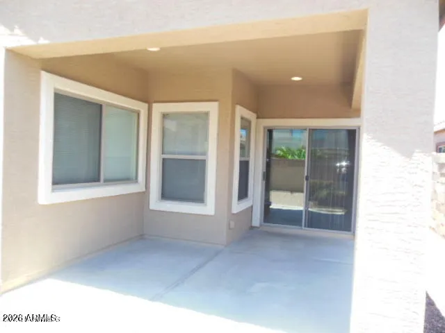 a view of an empty room with glass door