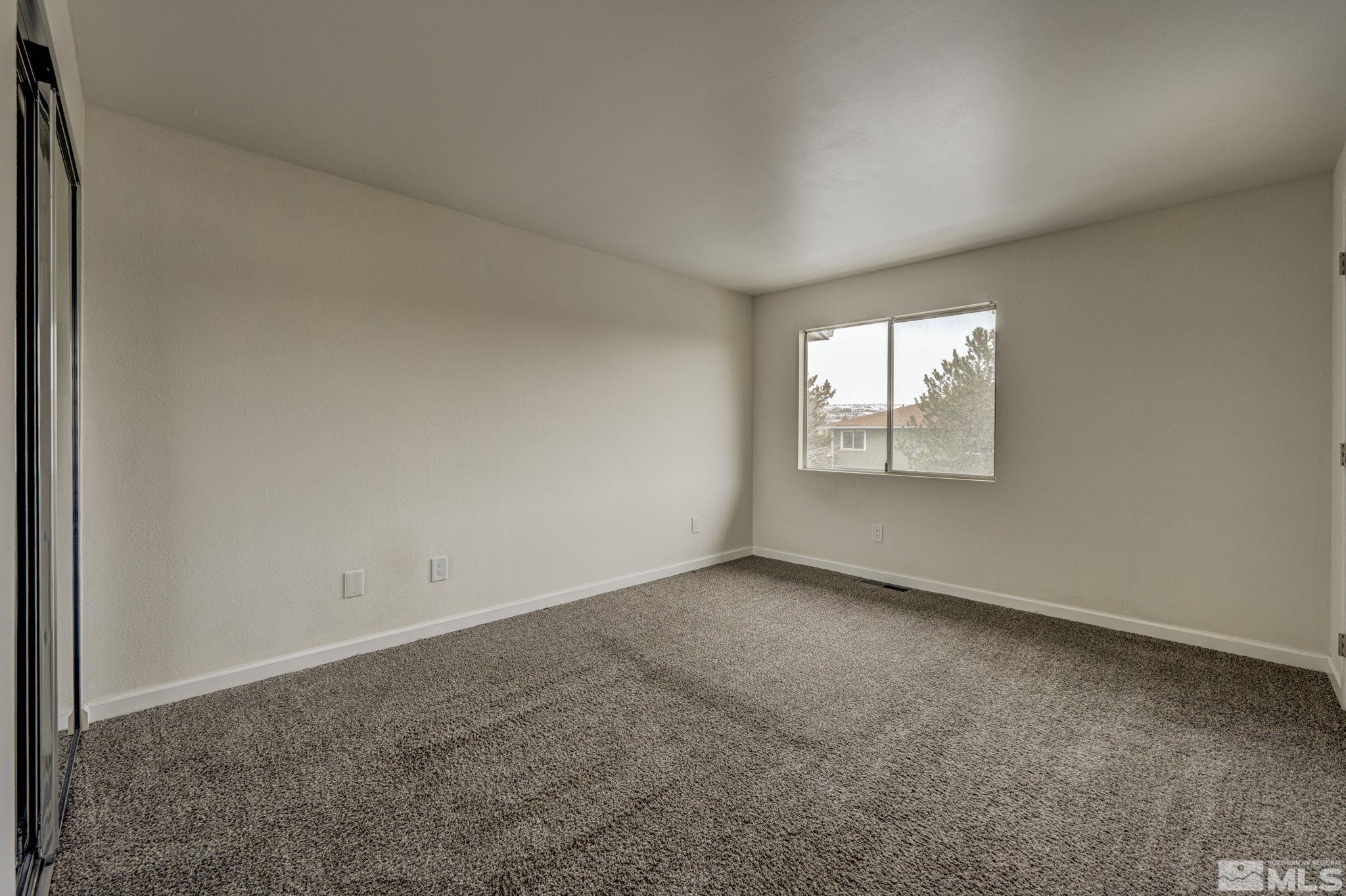 1424 East 9th Street, Unit 3 Reno, NV 89512 - Photo 16 of 26 an empty room with windows