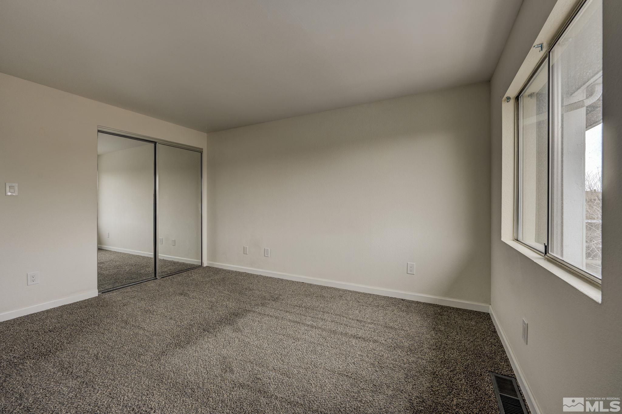1424 East 9th Street, Unit 3 Reno, NV 89512 - Photo 18 of 26 an empty room with windows and closet