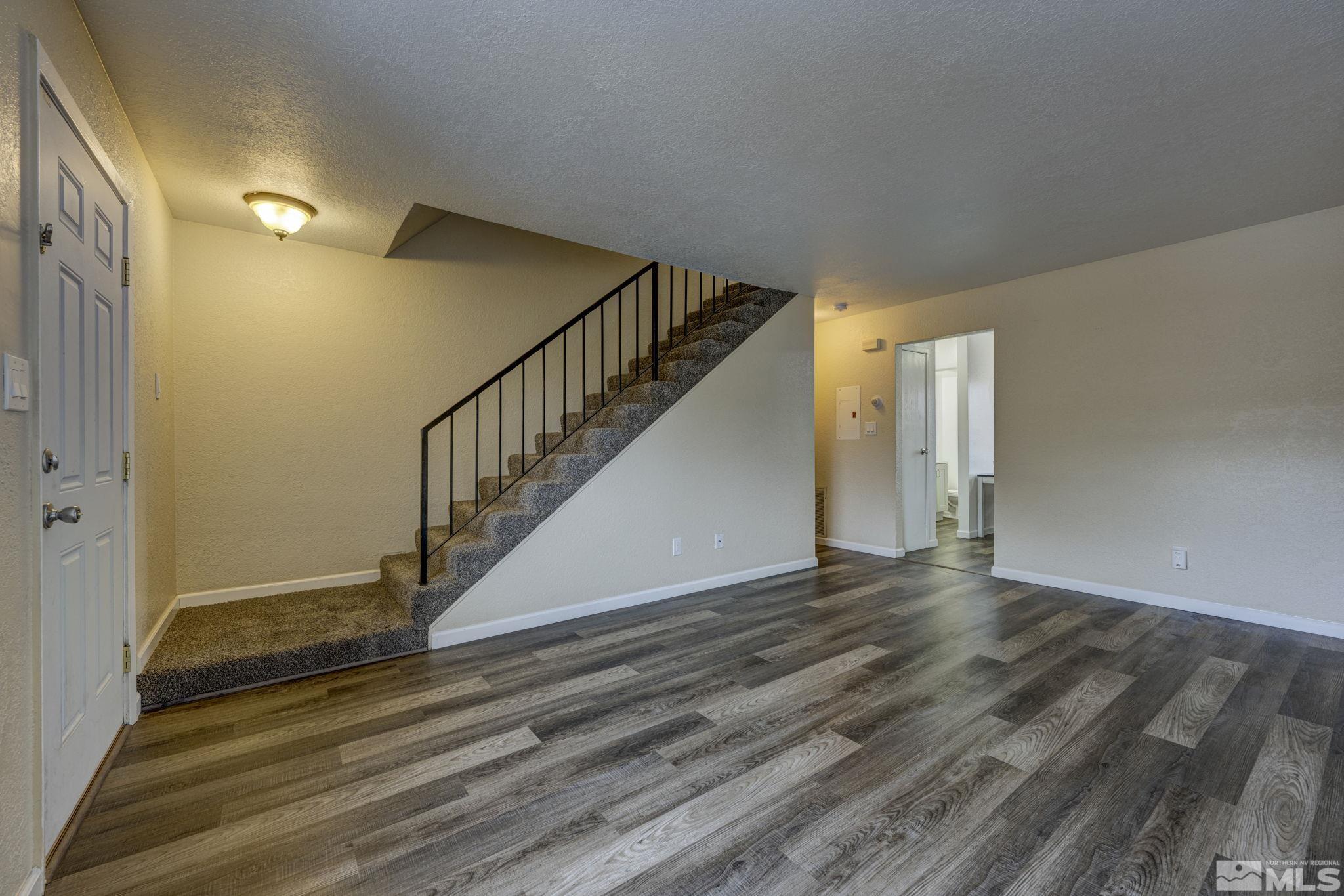 1424 East 9th Street, Unit 3 Reno, NV 89512 - Photo 4 of 26 a view of entryway and hall with wooden floor