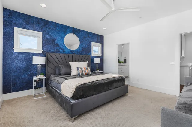 a bed room with a bed and a lamp