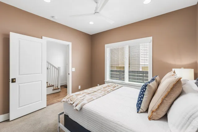 a bed room with a bed and a chair