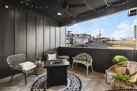 a view of a chairs and table in a patio