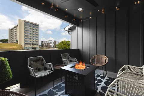 a kitchen with a table and chairs