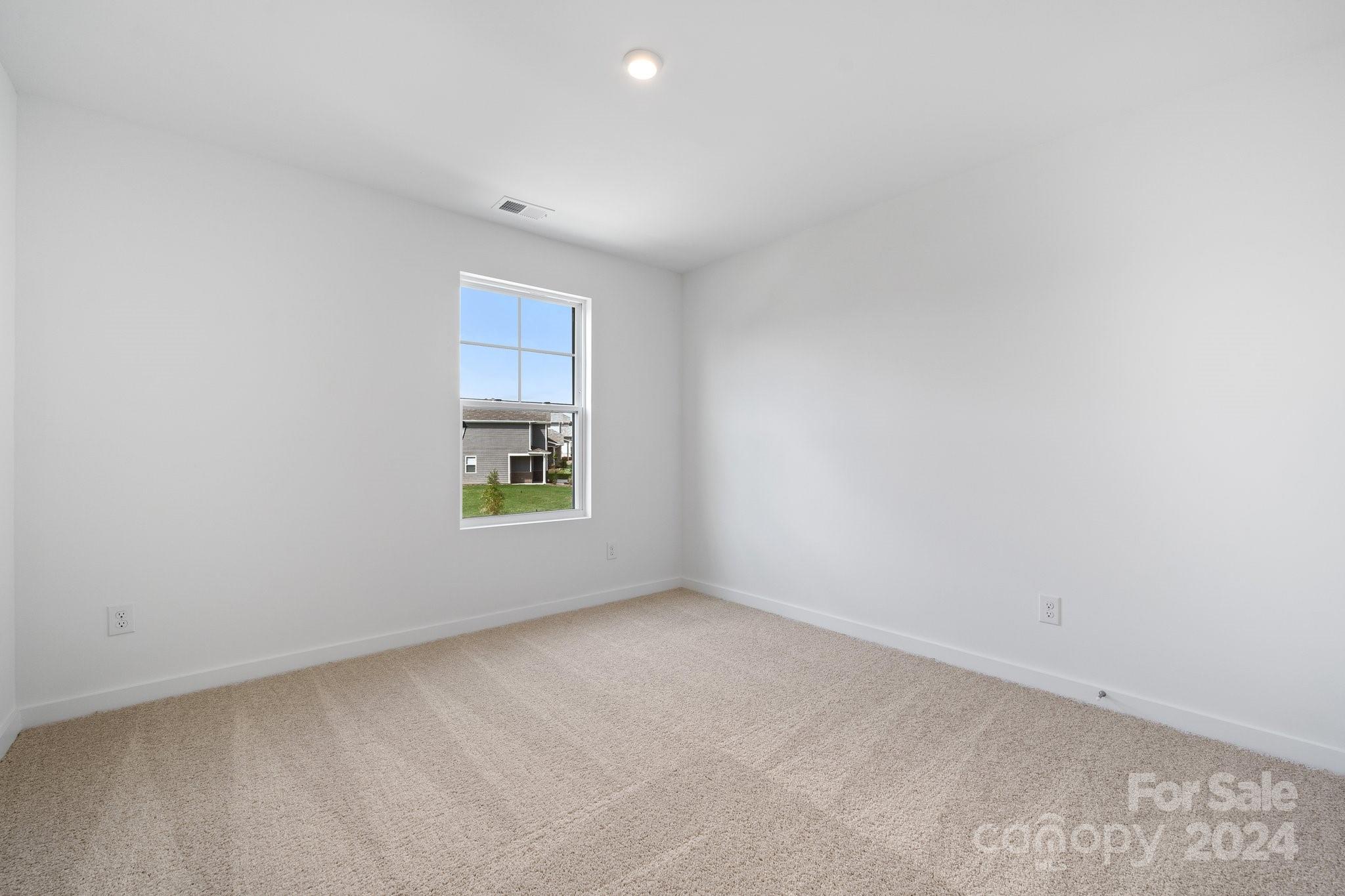2568 Blue Sky Mdws Drive Monroe, NC 28110 - Photo 15 of 28 an empty room with a window