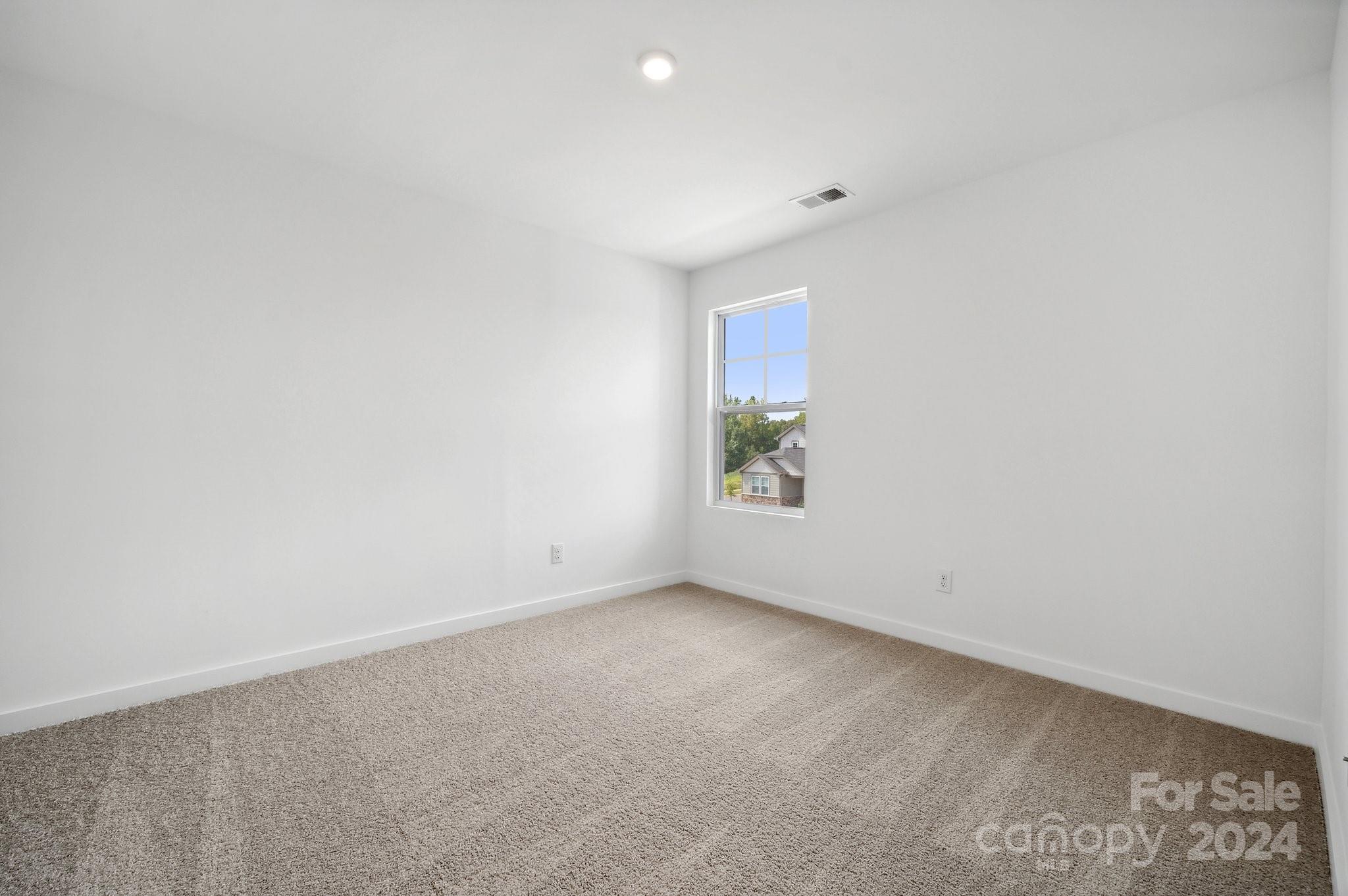 2568 Blue Sky Mdws Drive Monroe, NC 28110 - Photo 16 of 28 an empty room with windows