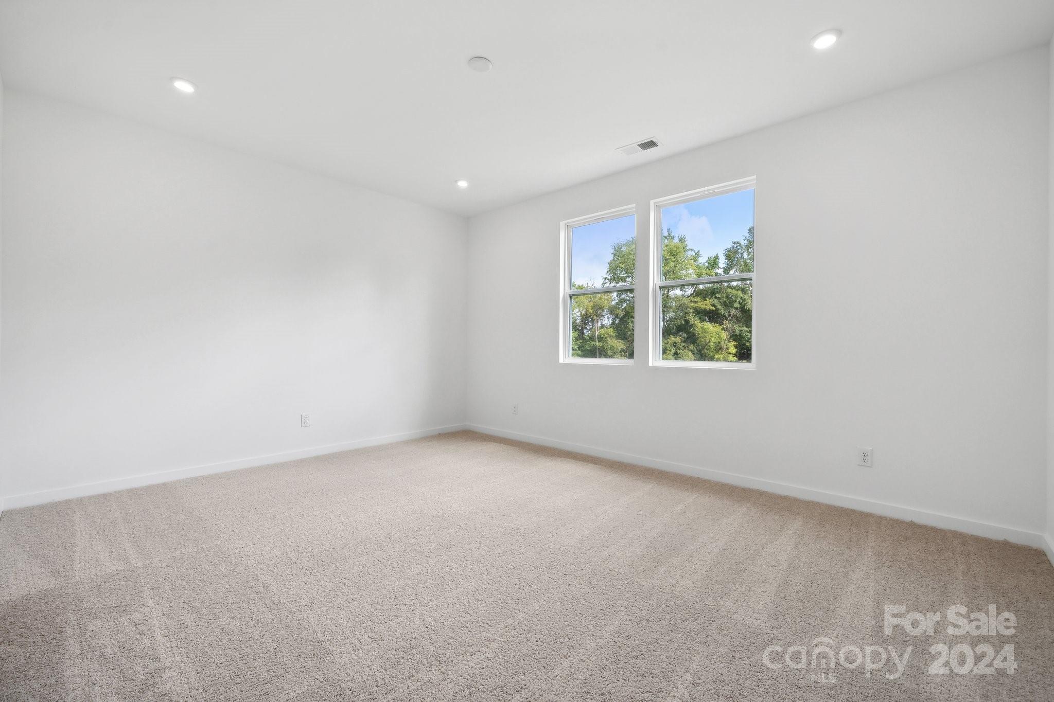 2568 Blue Sky Mdws Drive Monroe, NC 28110 - Photo 6 of 28 an empty room with windows