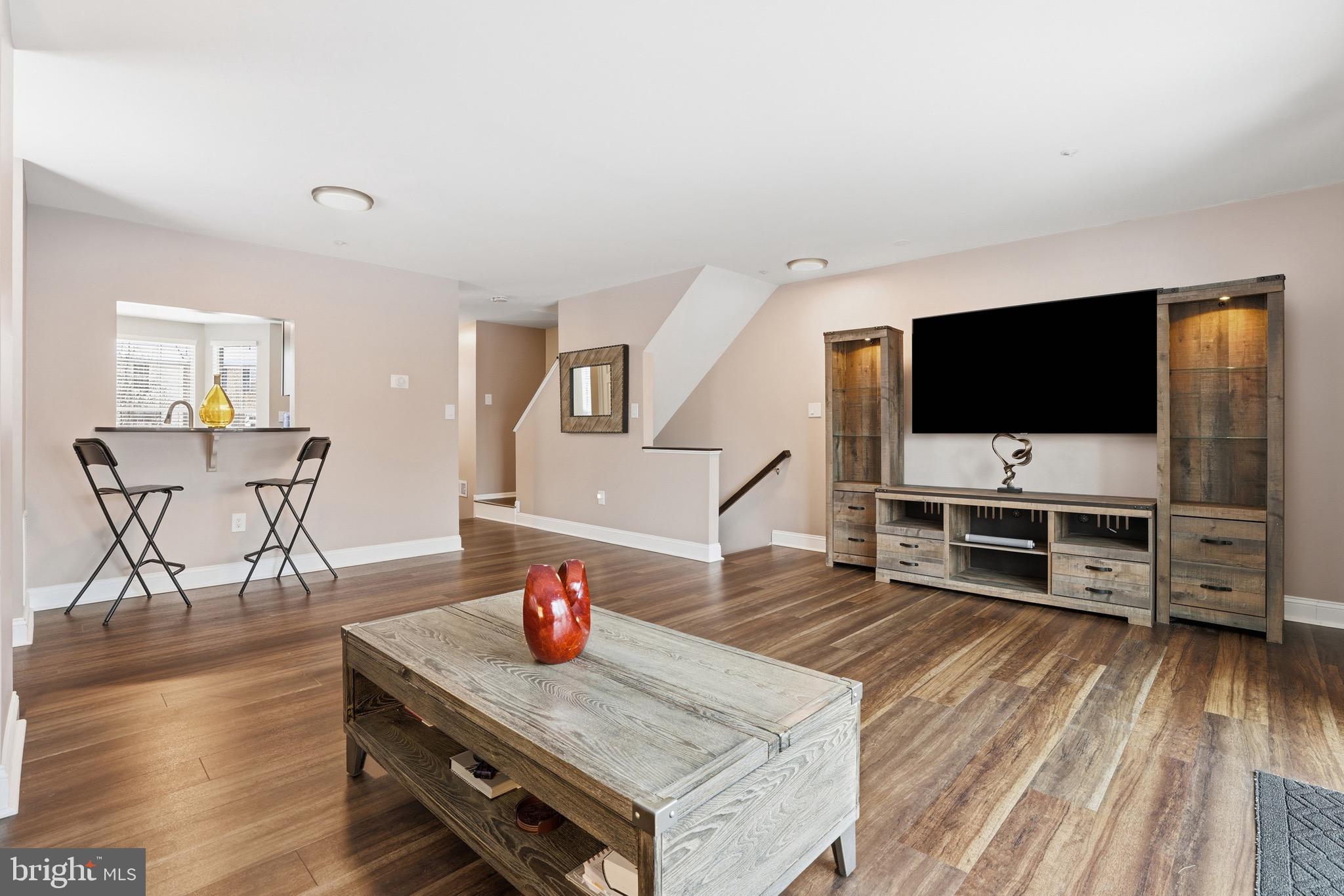 10724 Kitchener Court Bowie, MD 20721 - Photo 12 of 31 a living room with furniture and a flat screen tv