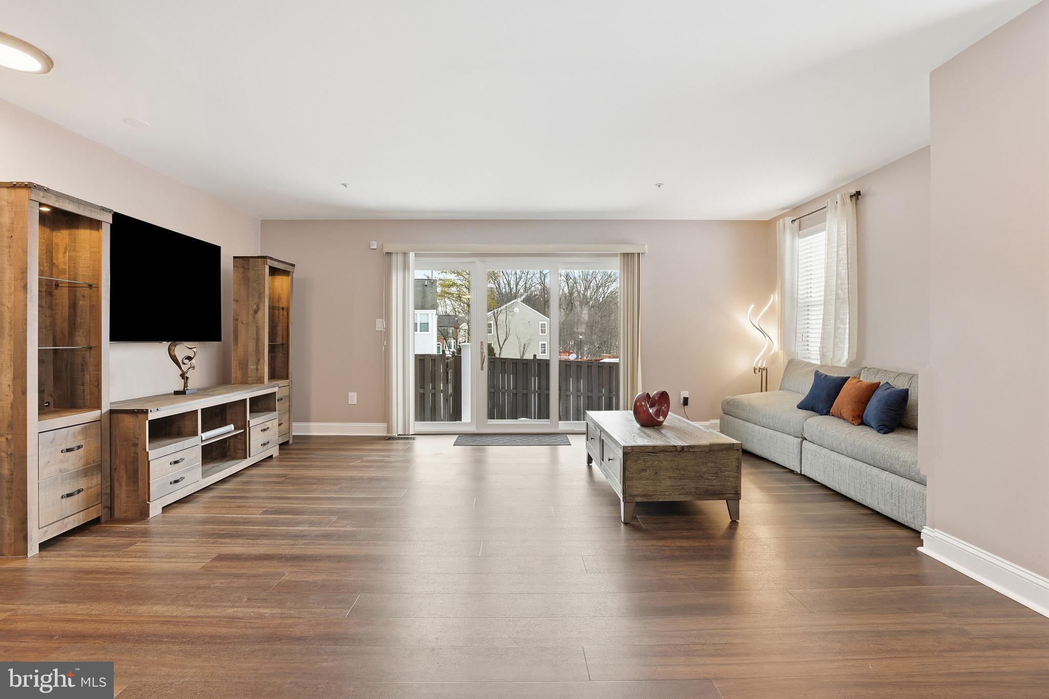 10724 Kitchener Court Bowie, MD 20721 - Photo 13 of 31 a living room with furniture and a flat screen tv
