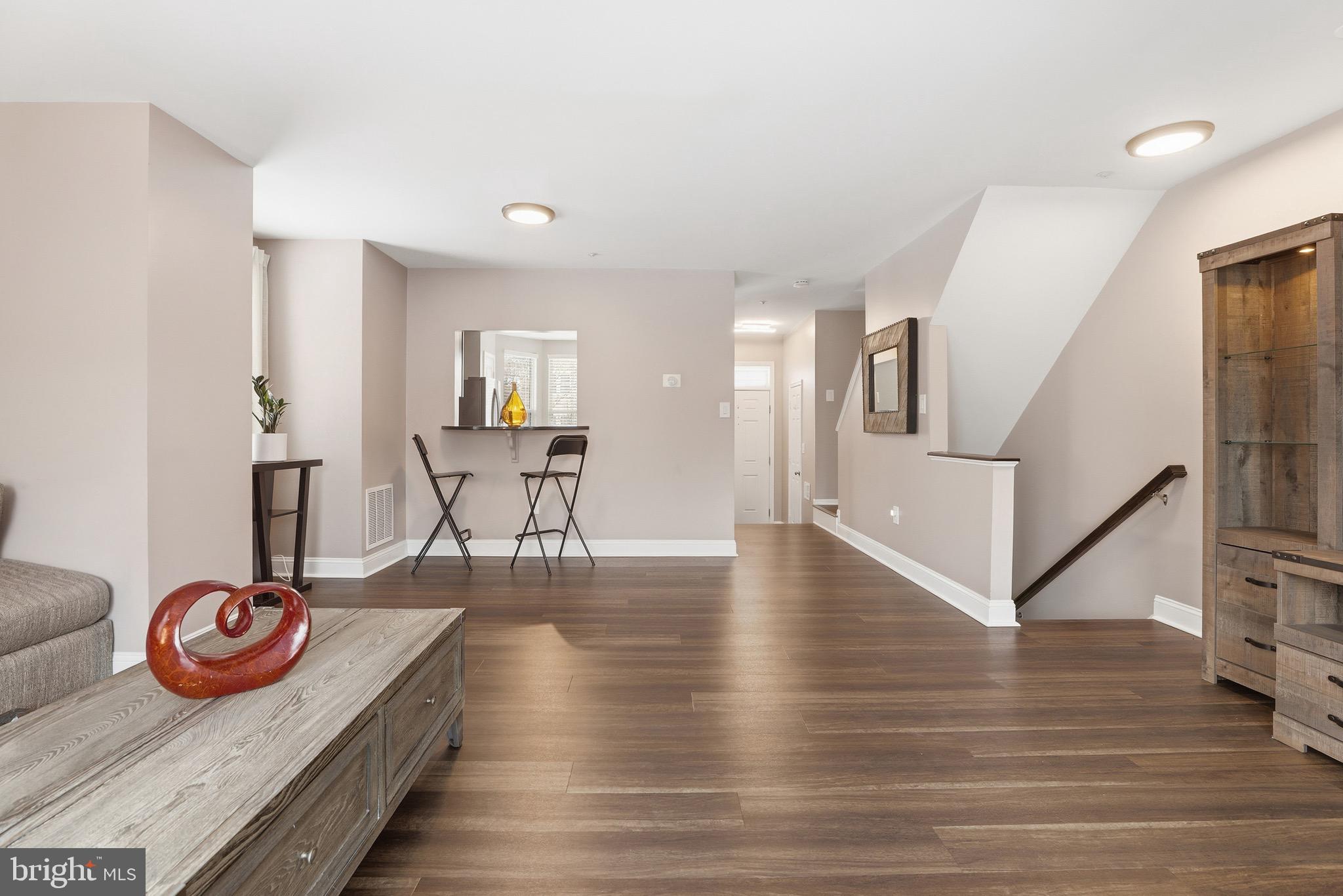 10724 Kitchener Court Bowie, MD 20721 - Photo 14 of 31 a dining room with furniture and wooden floor