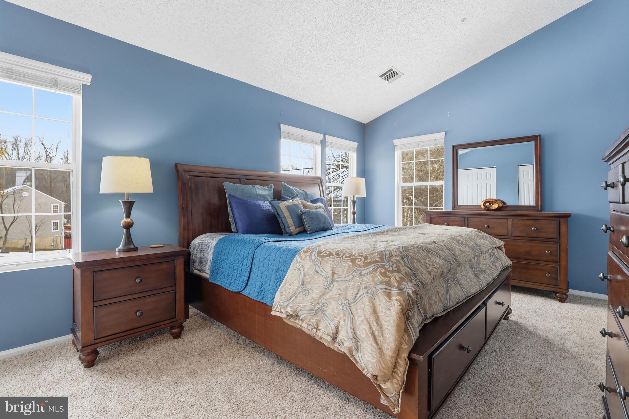 10724 Kitchener Court Bowie, MD 20721 - Photo 15 of 31 a spacious bedroom with a bed and window