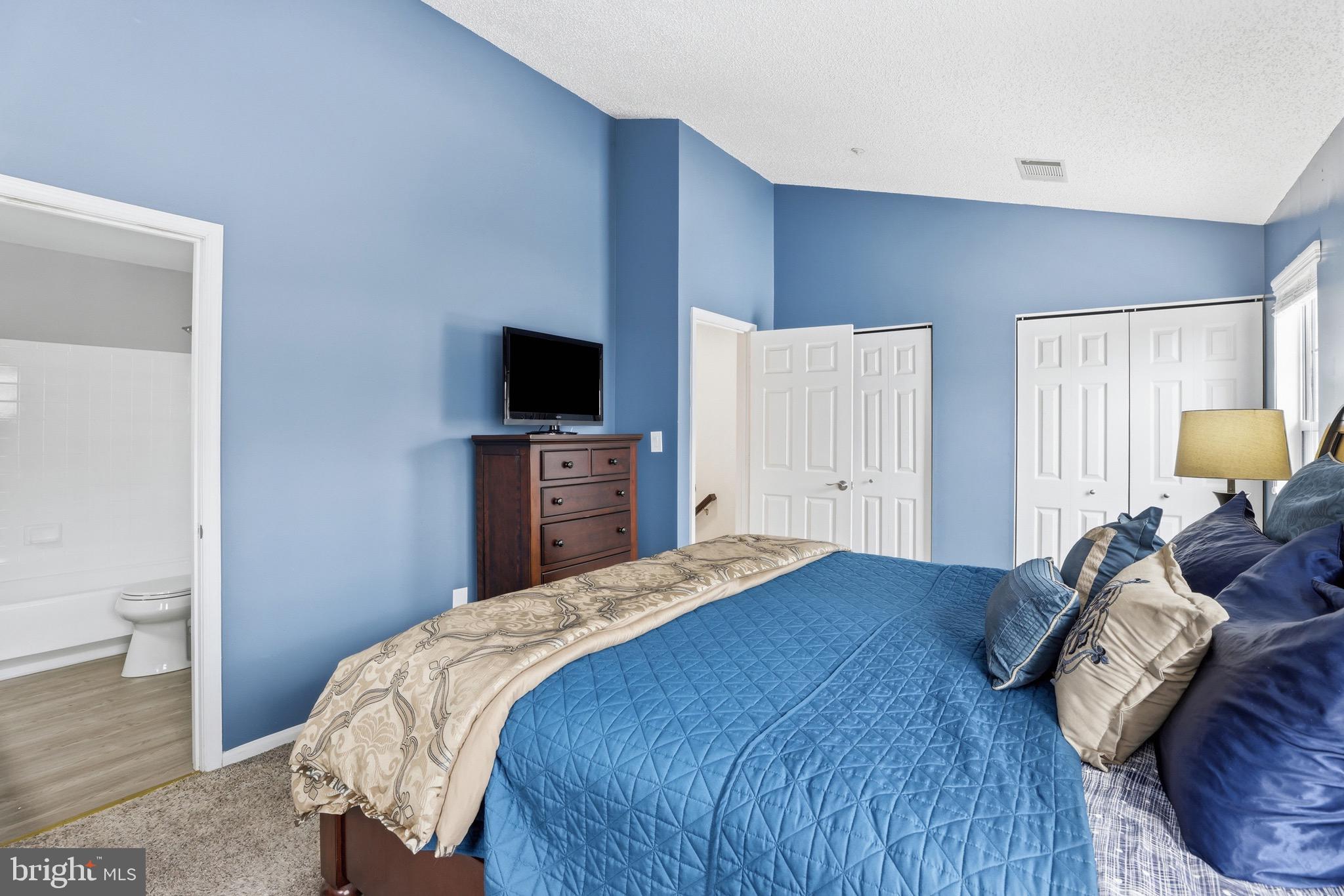 10724 Kitchener Court Bowie, MD 20721 - Photo 16 of 31 a bedroom with a bed and a television