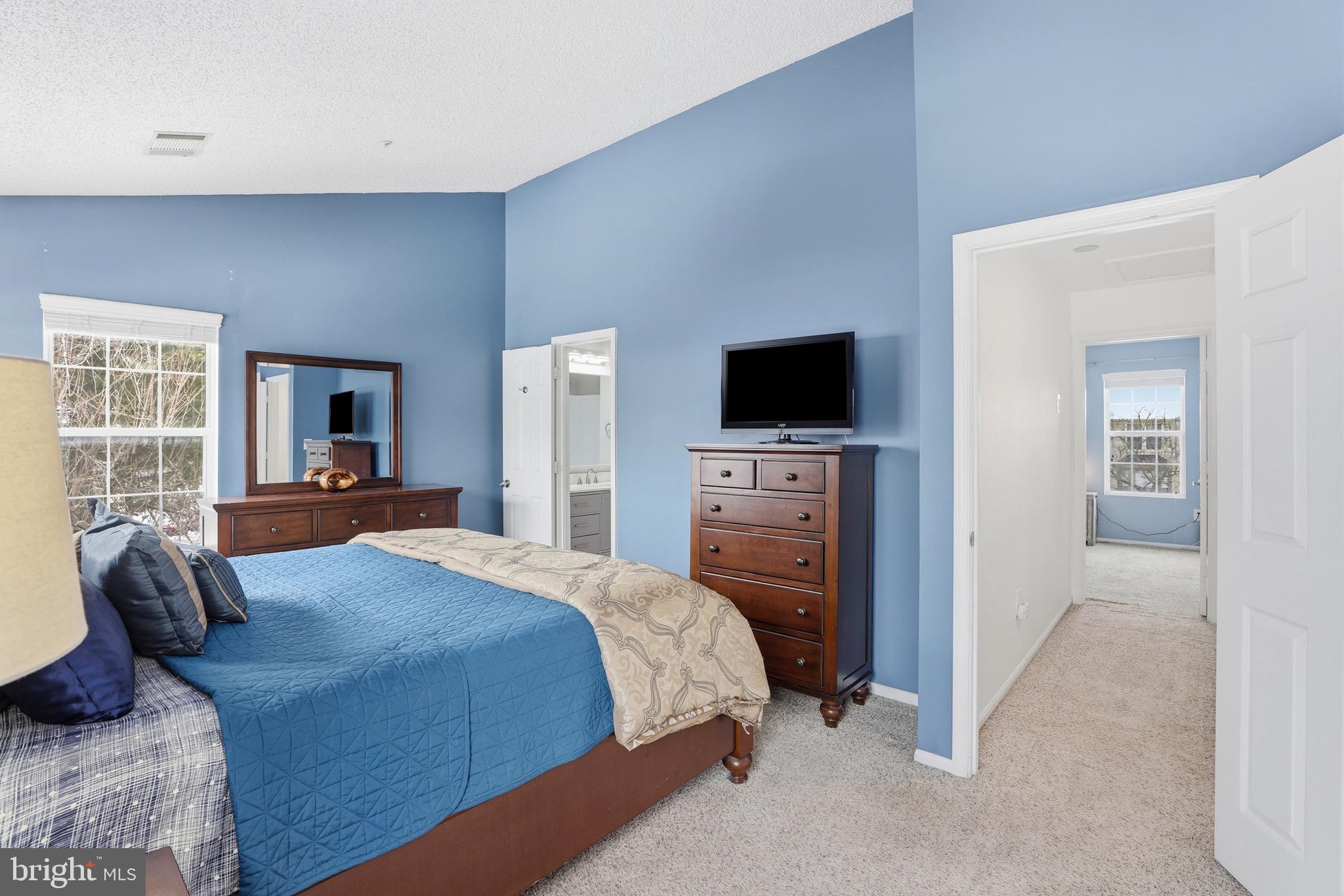 10724 Kitchener Court Bowie, MD 20721 - Photo 17 of 31 a bedroom with a bed and a flat screen tv