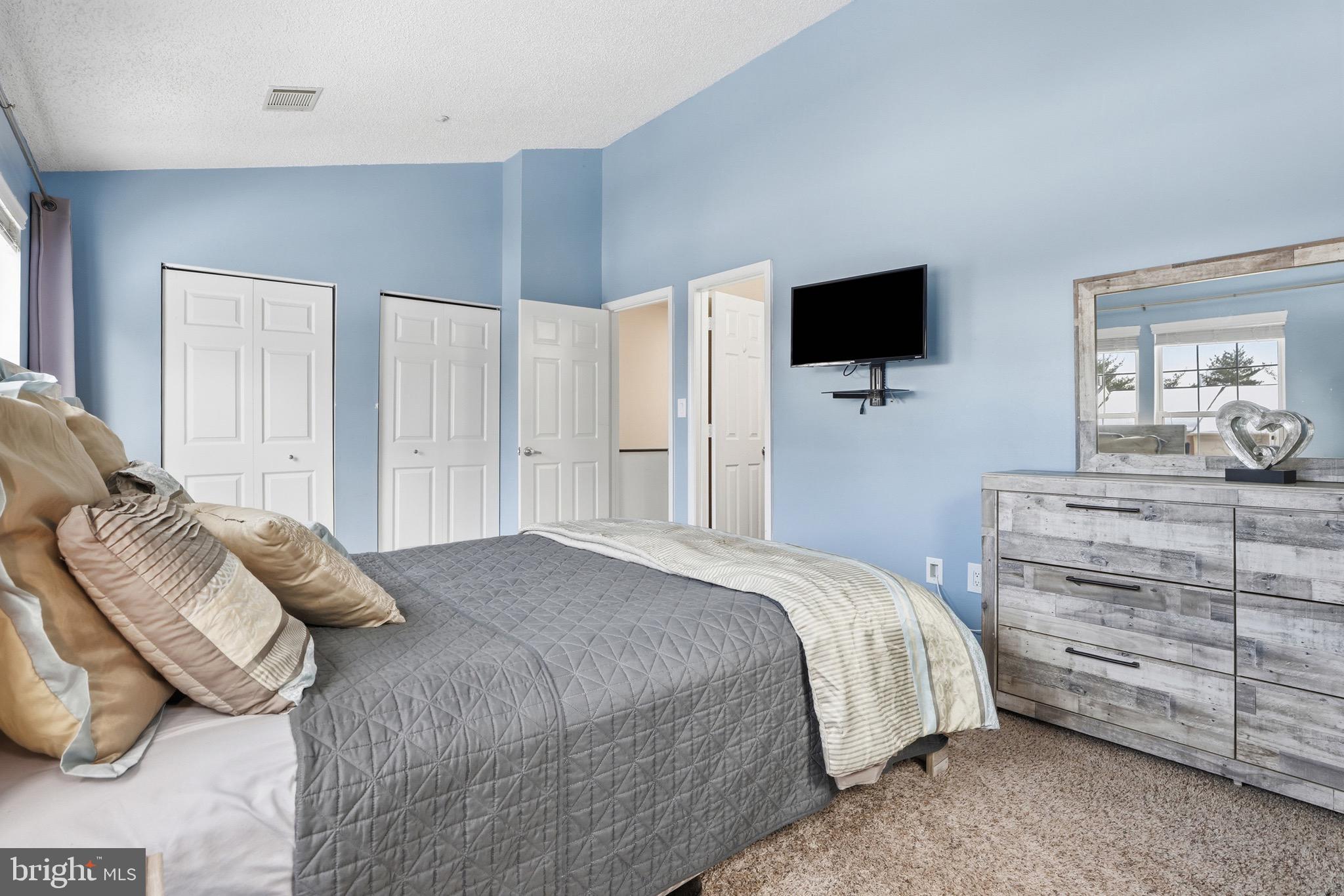 10724 Kitchener Court Bowie, MD 20721 - Photo 20 of 31 a bedroom with a bed and flat screen tv