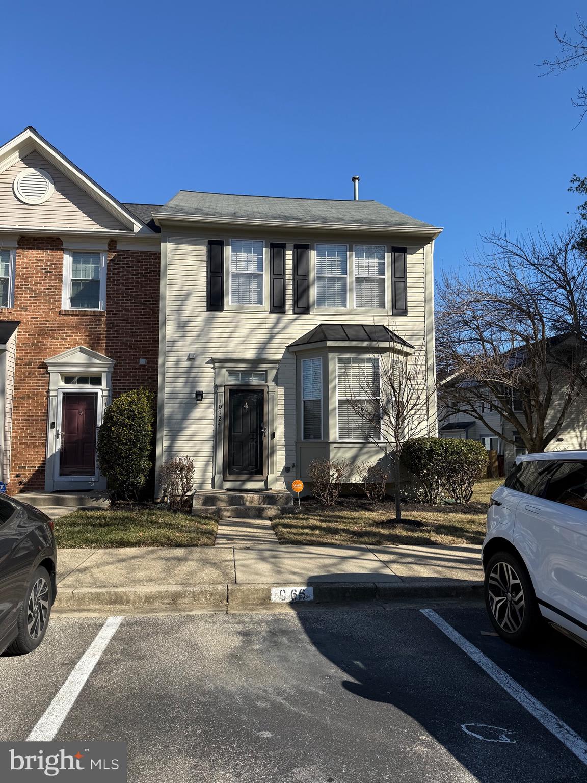 10724 Kitchener Court Bowie, MD 20721 - Photo 2 of 3 a front view of a house with a garden