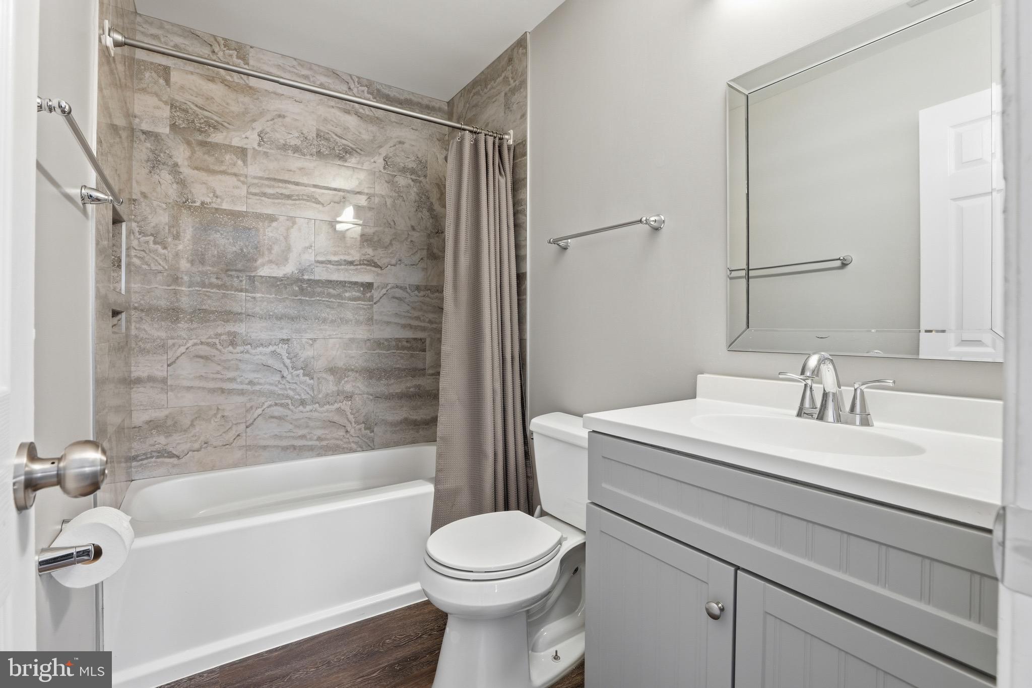 10724 Kitchener Court Bowie, MD 20721 - Photo 21 of 31 a bathroom with a sink toilet and shower