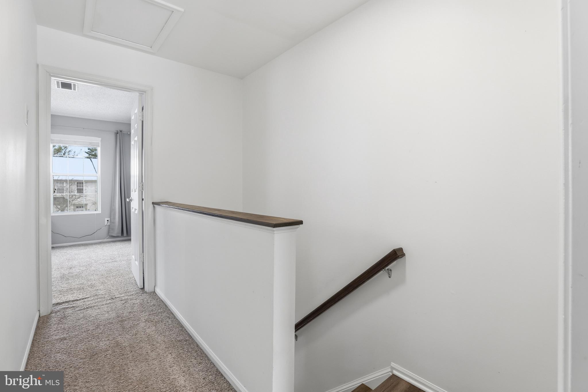 10724 Kitchener Court Bowie, MD 20721 - Photo 22 of 31 a view of a hallway with wooden floor and entryway