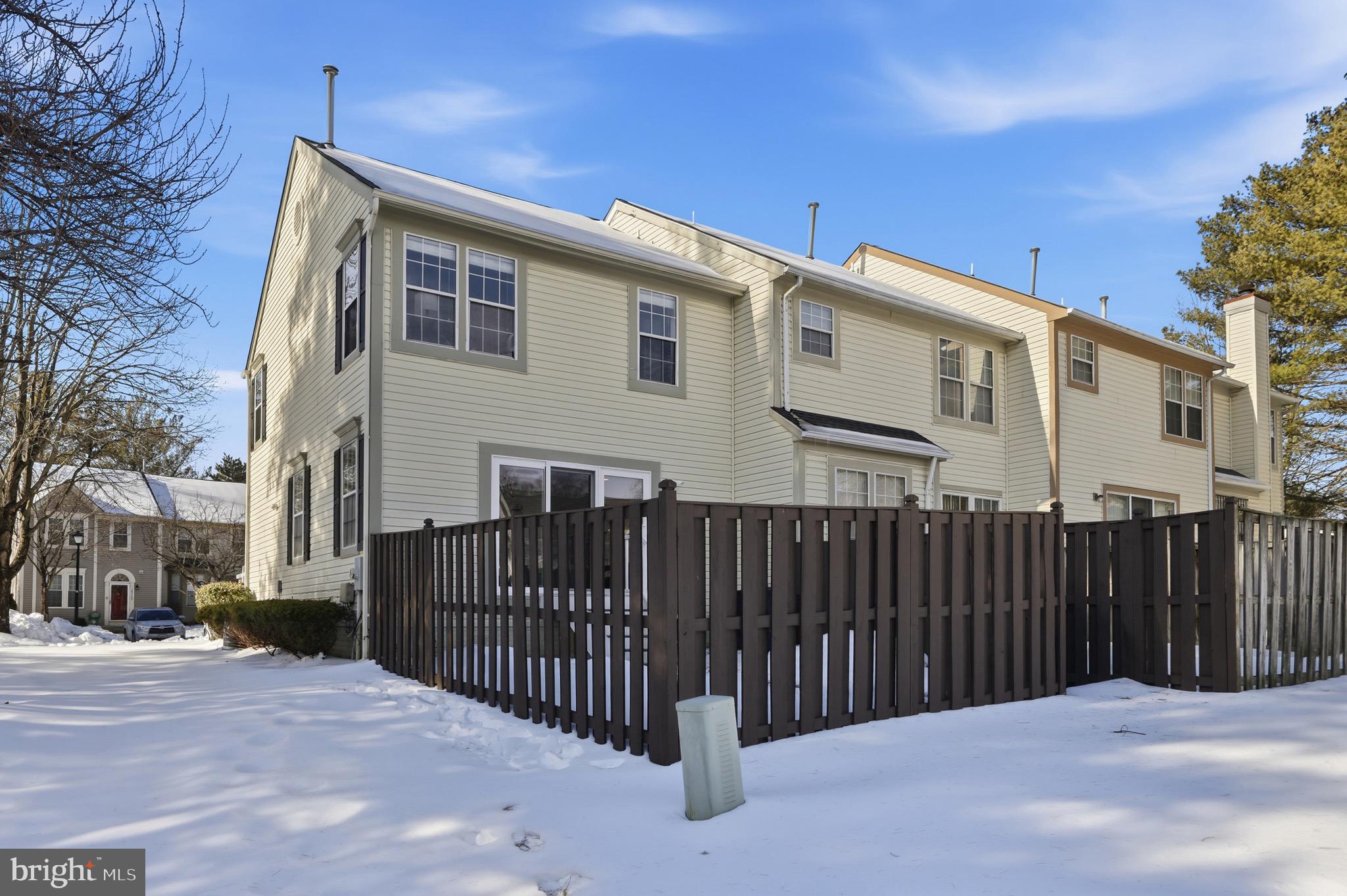 10724 Kitchener Court Bowie, MD 20721 - Photo 30 of 31 a view of a house with a wooden fence