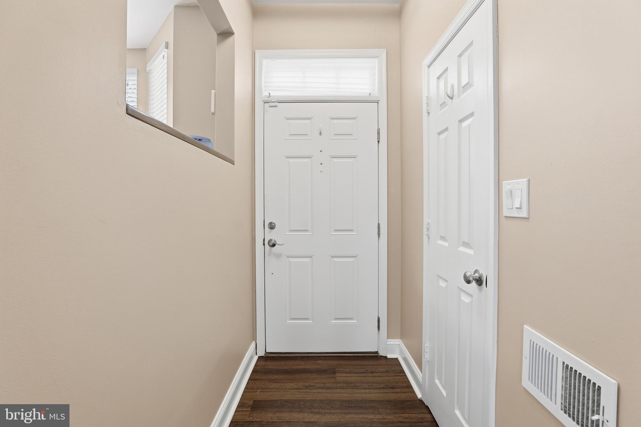 10724 Kitchener Court Bowie, MD 20721 - Photo 5 of 31 a view of a hallway with wooden floor and entryway