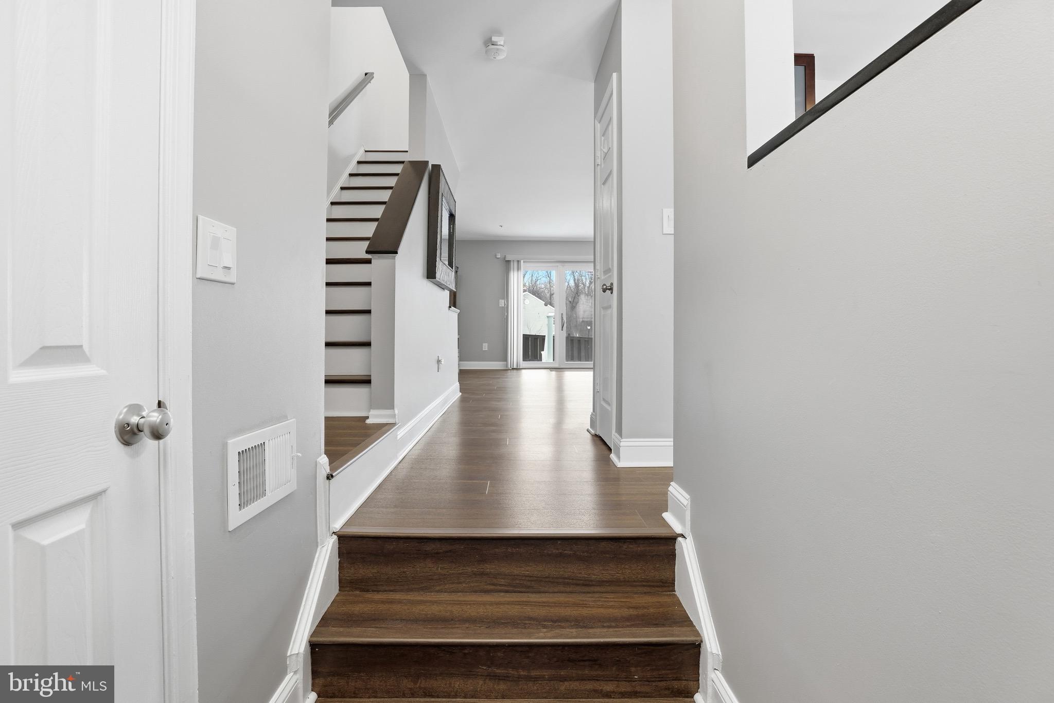 10724 Kitchener Court Bowie, MD 20721 - Photo 6 of 31 a view of entryway and hall with wooden floor