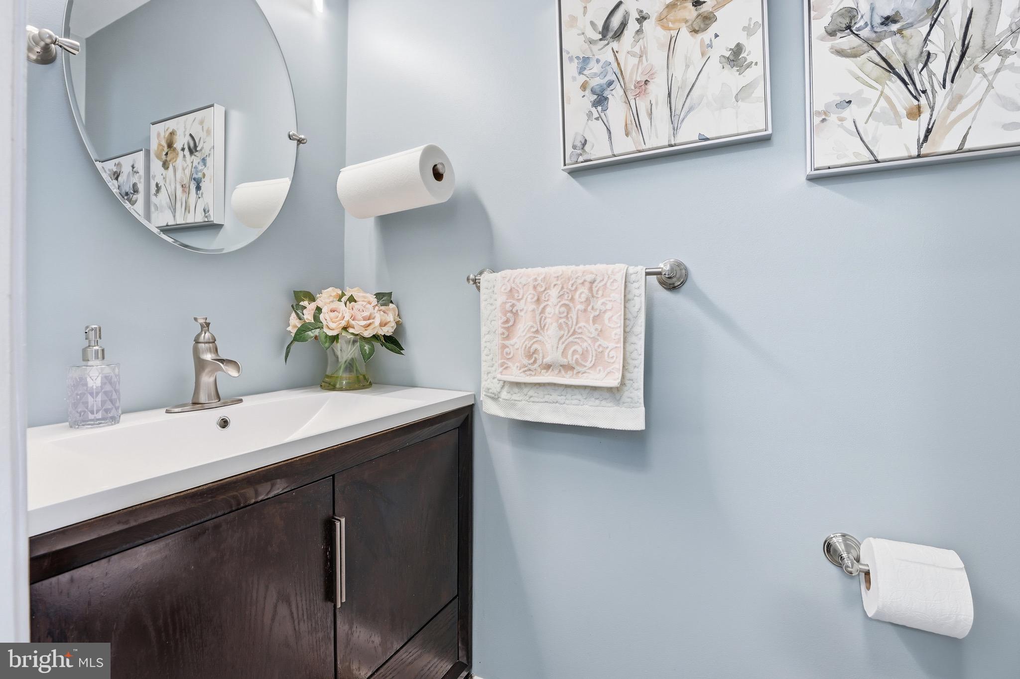 10724 Kitchener Court Bowie, MD 20721 - Photo 7 of 31 a bathroom with a sink and a mirror