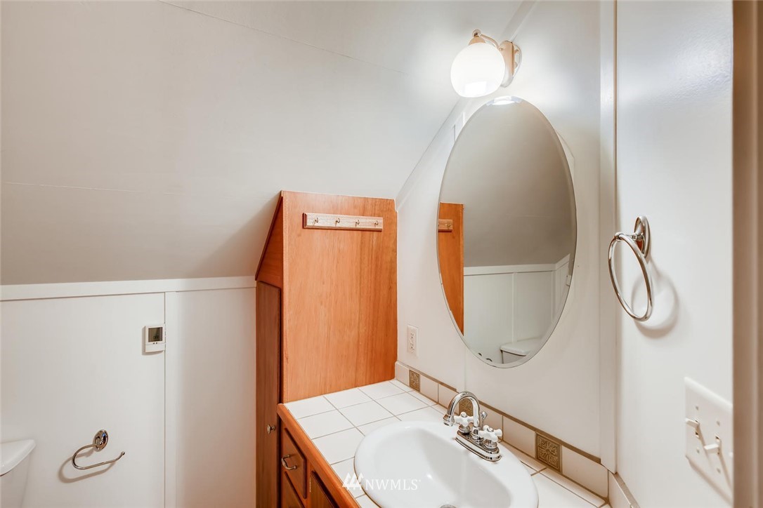 1523 Lake Avenue South Renton, WA 98055 - Photo 18 of 27 a bathroom with a sink and a mirror