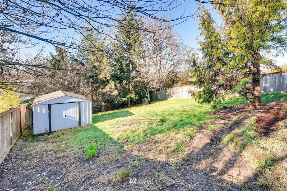 1523 Lake Avenue South Renton, WA 98055 - Photo 27 of 27 a view of a house with a yard and large tree