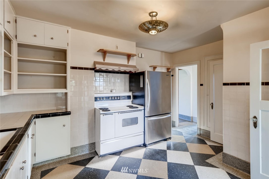 1523 Lake Avenue South Renton, WA 98055 - Photo 9 of 27 a kitchen with stainless steel appliances a stove a sink and a refrigerator