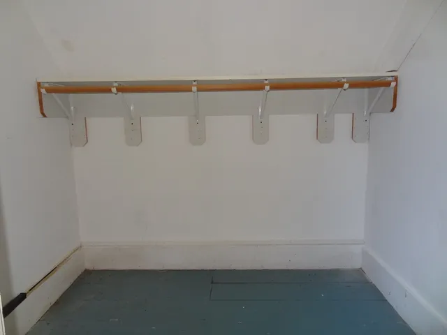a view of a room with racks on the wall