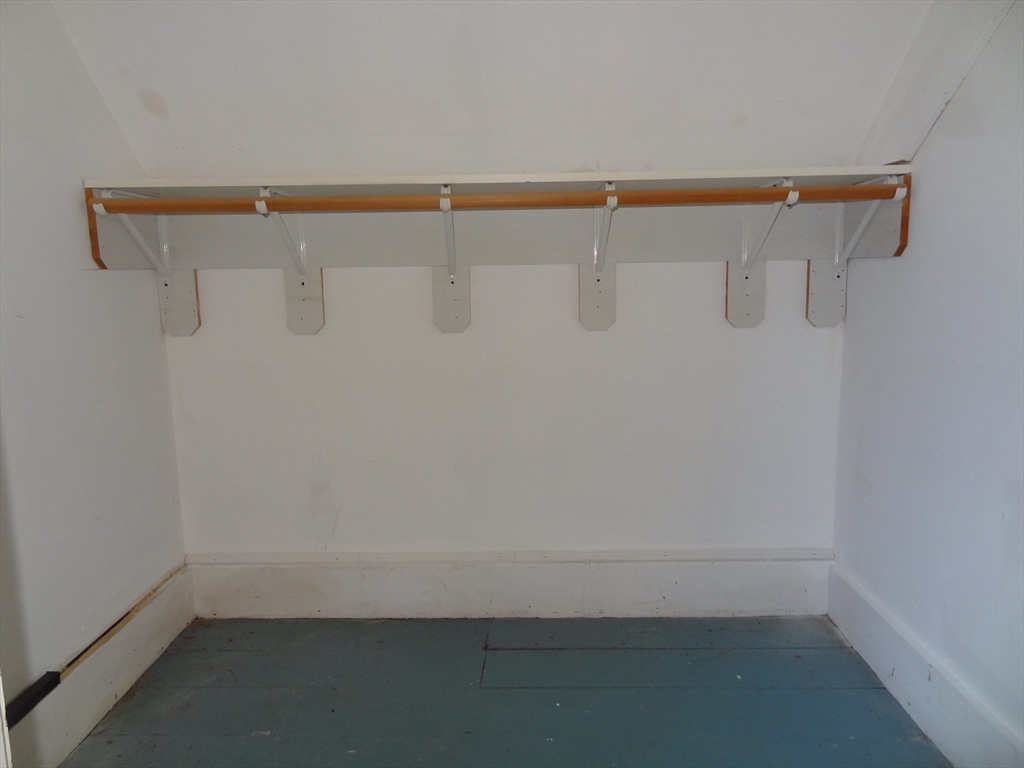 48 Maple Street, Unit 2 Holden, MA 01520 - Photo 11 of 17 a view of a room with racks on the wall