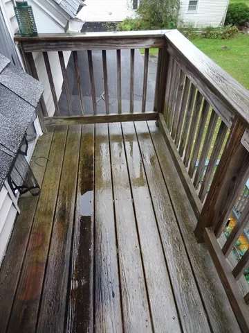 a view of outdoor space with deck and yard
