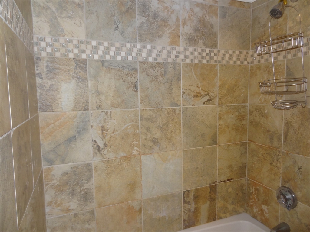 48 Maple Street, Unit 2 Holden, MA 01520 - Photo 14 of 17 a bathroom with a shower