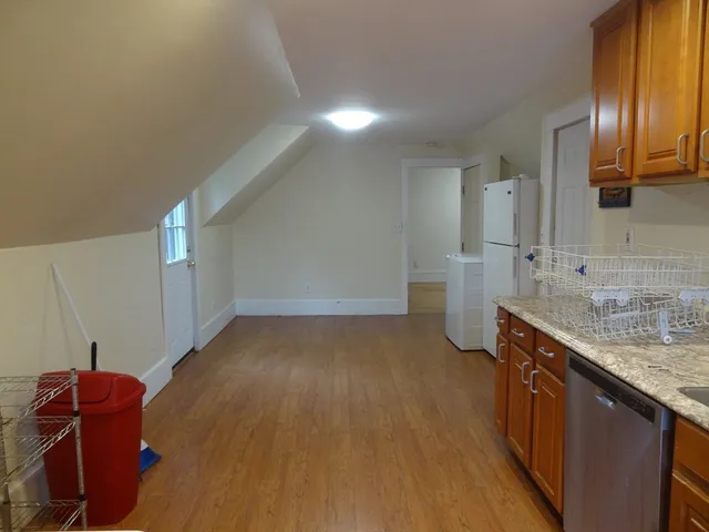 a kitchen with a sink and a refrigerator
