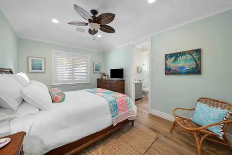 a bedroom with a bed and chair