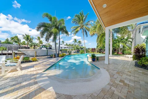 a view of outdoor space with seating area and swimming pool