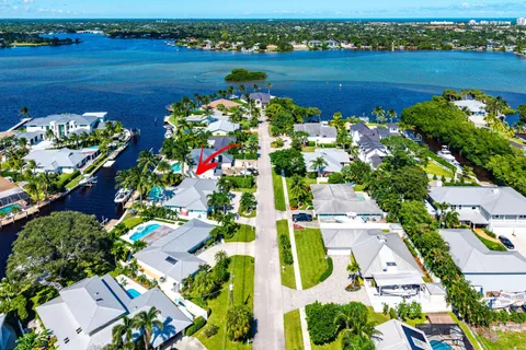 an aerial view of a houses with yard