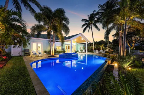 a view of a lake with a table and chairs