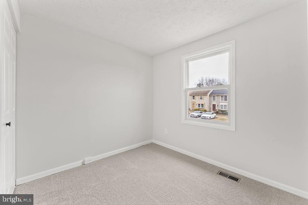 14743 Winding Loop Woodbridge, VA 22191 - Photo 13 of 36 an empty room with windows