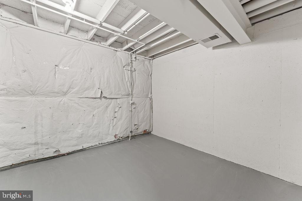 14743 Winding Loop Woodbridge, VA 22191 - Photo 24 of 36 a view of a room with racks on the wall