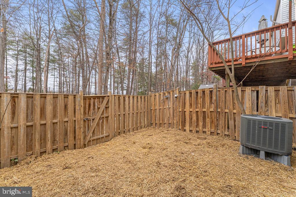 14743 Winding Loop Woodbridge, VA 22191 - Photo 26 of 36 a view of a backyard of the house