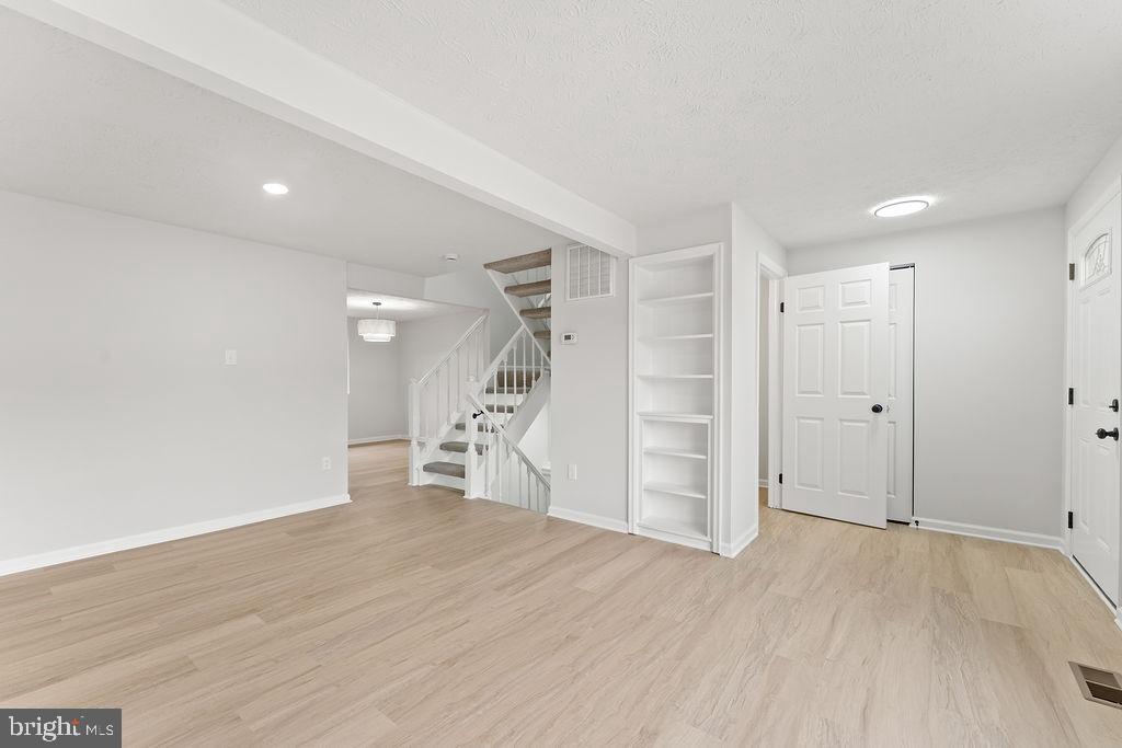 14743 Winding Loop Woodbridge, VA 22191 - Photo 3 of 36 a view of empty room with wooden floor