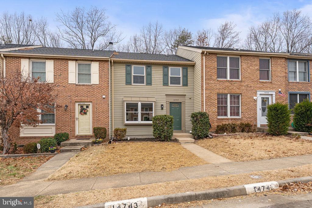 14743 Winding Loop Woodbridge, VA 22191 - Photo 33 of 36 a front view of a house with a yard